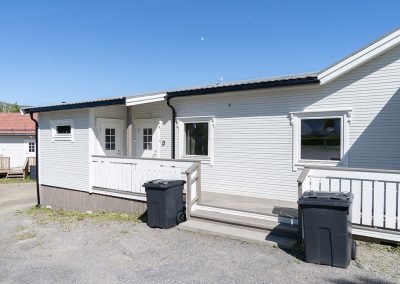 Exterior of a white building with an entrance area